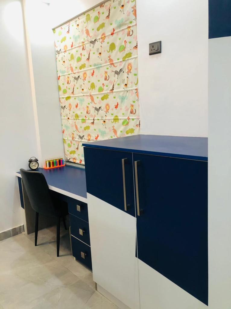 Kids study area with desk and shelves