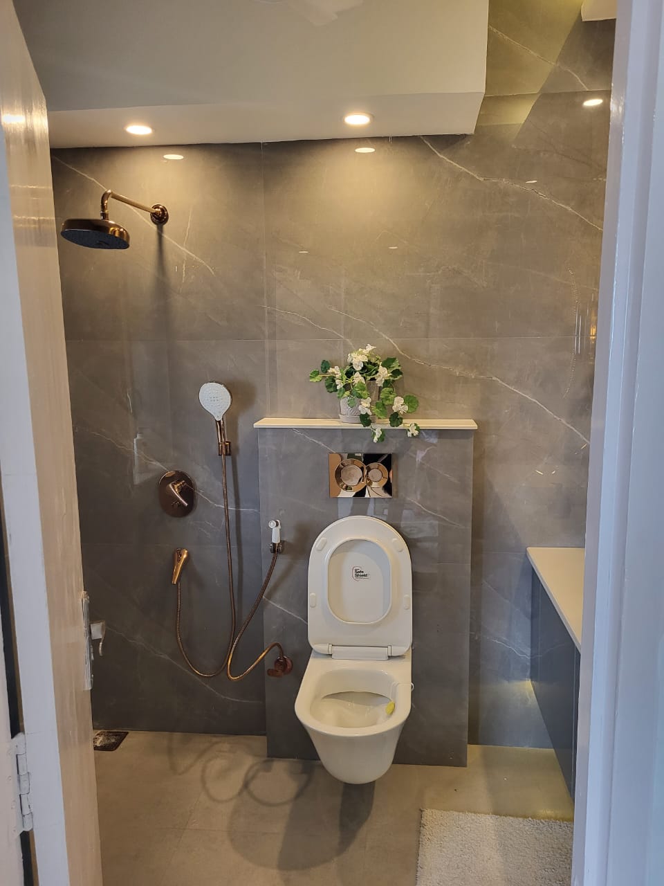 WC zone with concealed cistern and warm lighting